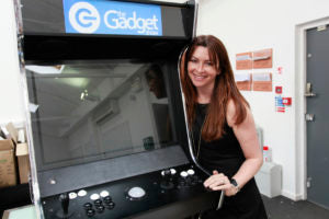 Gadget Show's Suzy hugging a Bespoke Arcades Evo